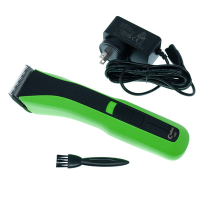 A green and black cordless hair clipper shown with its black power adapter and a small black cleaning brush on a plain white background.